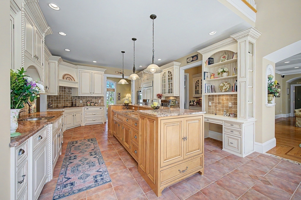 6 Trailside Way Norfolk, MA 02056 - Photo 11 of 42 a large kitchen with stainless steel appliances granite countertop a stove and cabinets