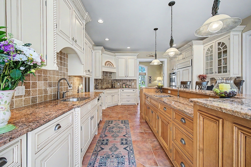 6 Trailside Way Norfolk, MA 02056 - Photo 12 of 42 a large kitchen with granite countertop a sink and white cabinets