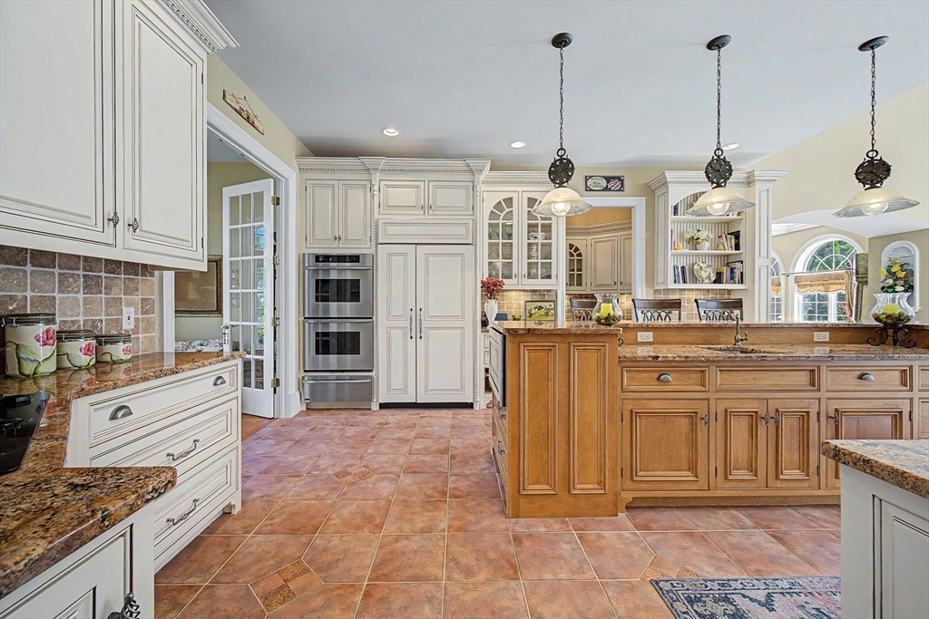 6 Trailside Way Norfolk, MA 02056 - Photo 14 of 42 a kitchen with stainless steel appliances granite countertop a stove and a white cabinets