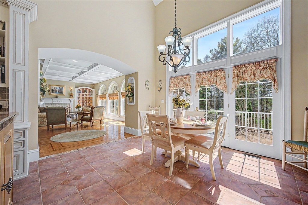 6 Trailside Way Norfolk, MA 02056 - Photo 16 of 42 a view of a dining room with furniture large windows and wooden floor