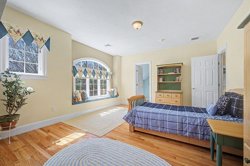 6 Trailside Way Norfolk, MA 02056 - Photo 32 of 42 a bedroom with a bed and wooden floor