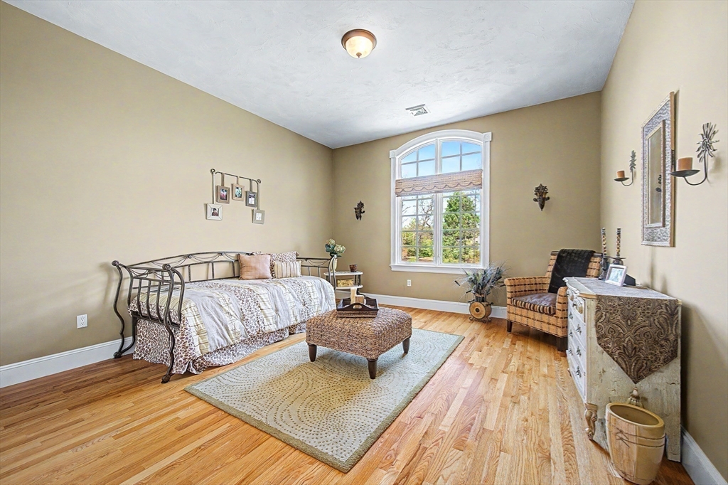 6 Trailside Way Norfolk, MA 02056 - Photo 33 of 42 a spacious bedroom with a bed and wooden floor