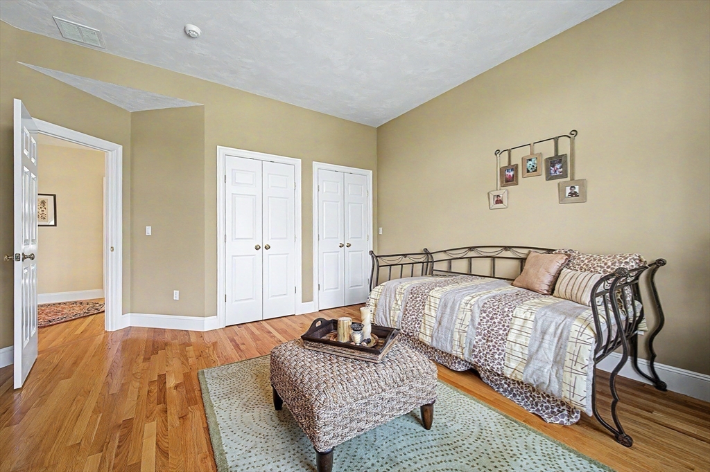 6 Trailside Way Norfolk, MA 02056 - Photo 34 of 42 a bedroom with a bed and wooden floor