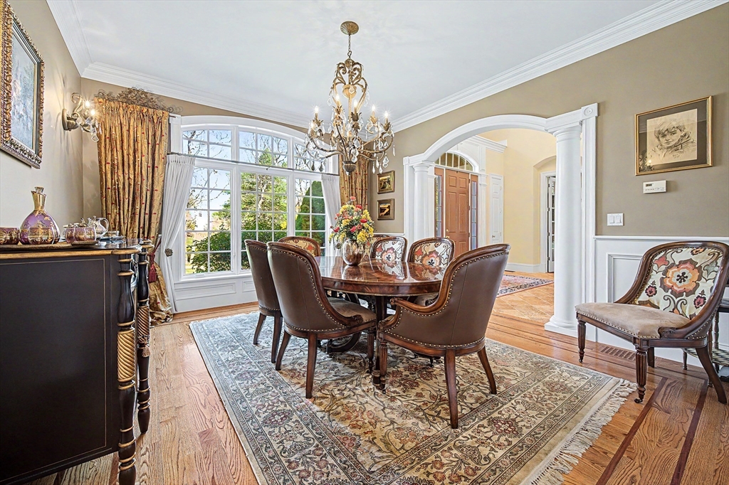 6 Trailside Way Norfolk, MA 02056 - Photo 7 of 42 a view of a dining room with furniture a chandelier and wooden floor