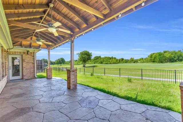 a view of a backyard with swimming pool