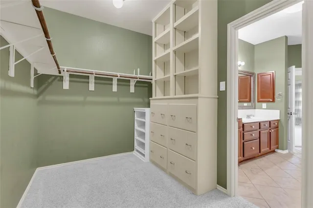 a view of room with window and ceiling fan