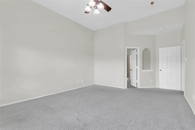 a bathroom with a sink mirror and toilet