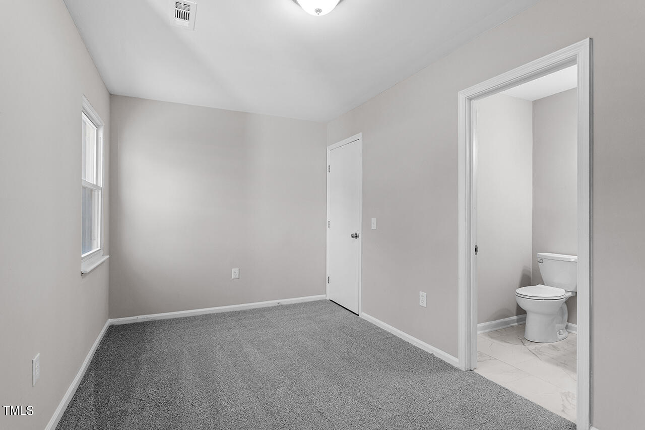 1209 Hazelnut Drive Raleigh, NC 27610 - Photo 15 of 24 a view of a bathroom with toilet
