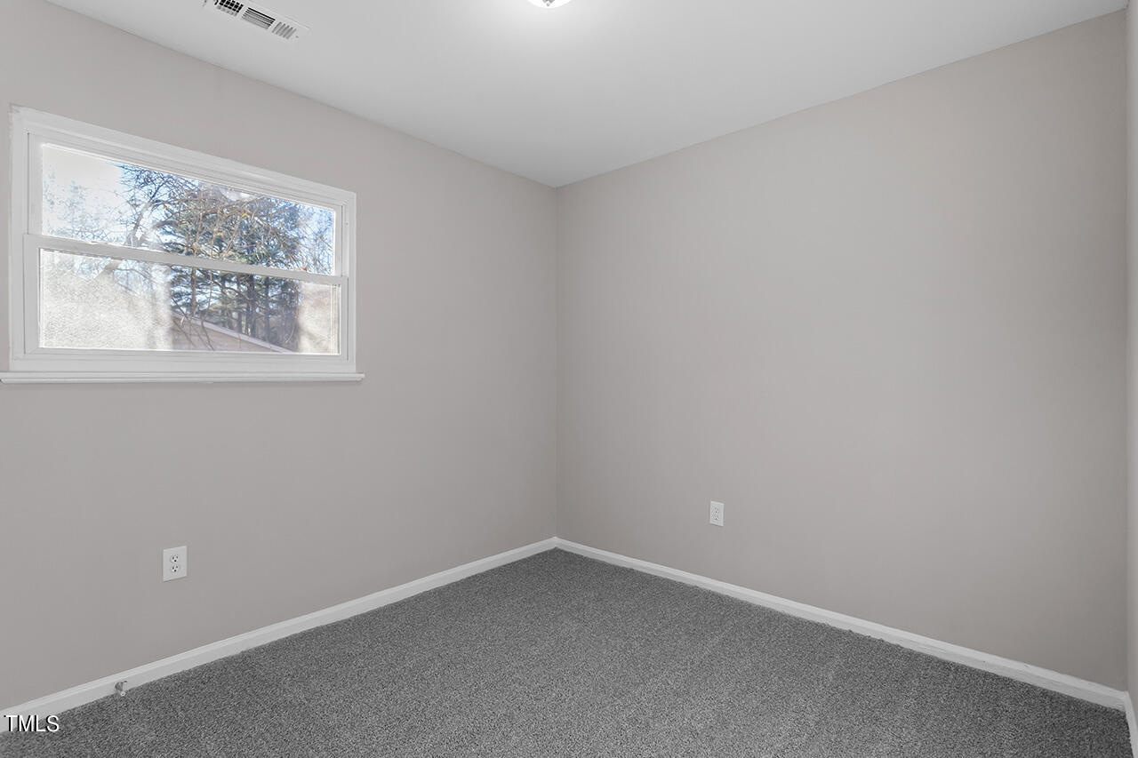 1209 Hazelnut Drive Raleigh, NC 27610 - Photo 17 of 24 an empty room with a window