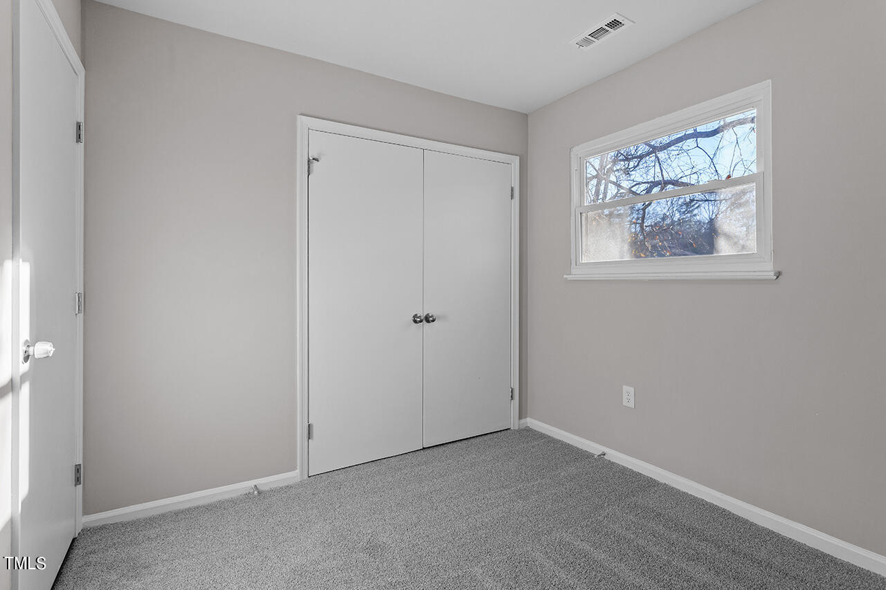 1209 Hazelnut Drive Raleigh, NC 27610 - Photo 19 of 24 a view of an empty room with a window