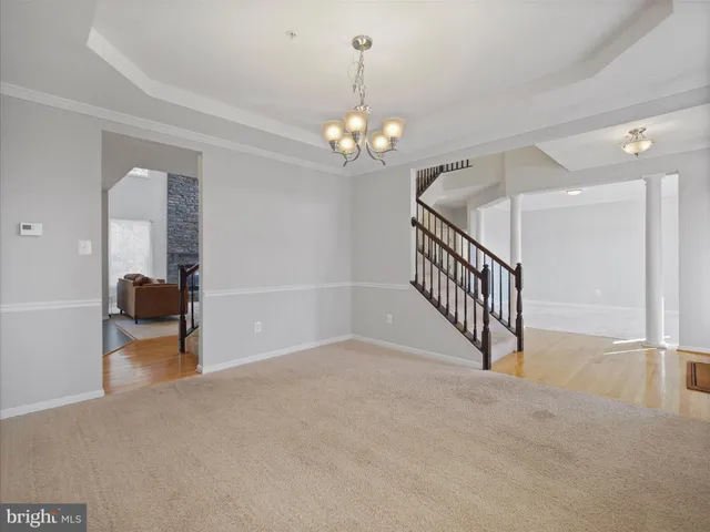 wooden floor in a hall with a window