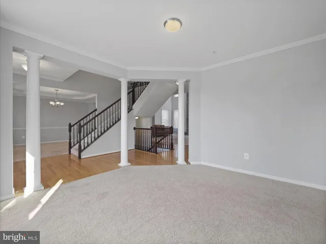 a view of a hallway with staircase