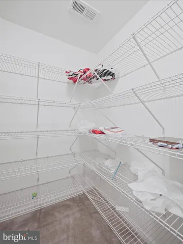 a bathroom with a toilet a sink and a mirror