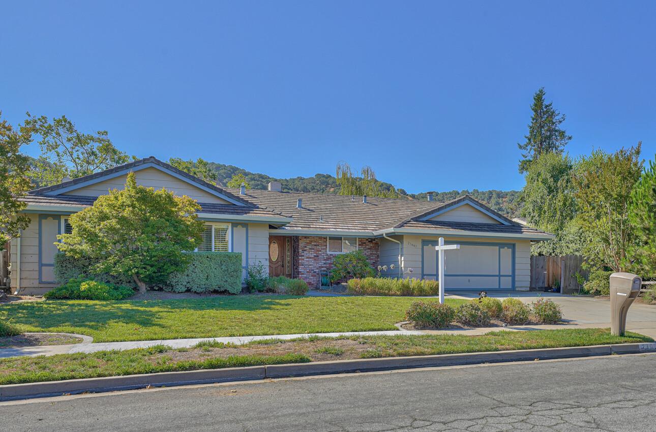 a front view of a house with a garden