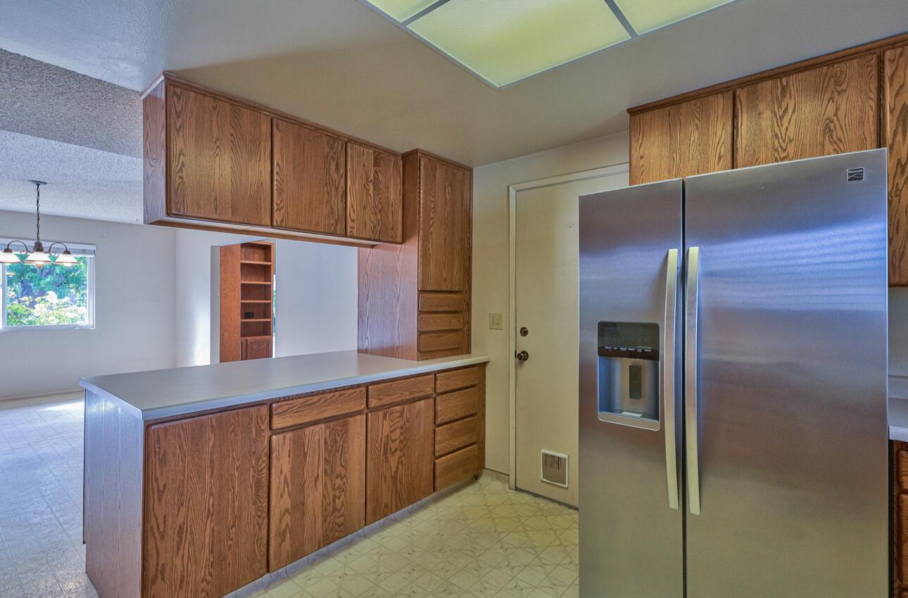 23007 Espada Drive Salinas, CA 93908 - Photo 13 of 39 a kitchen with cabinets and stainless steel appliances