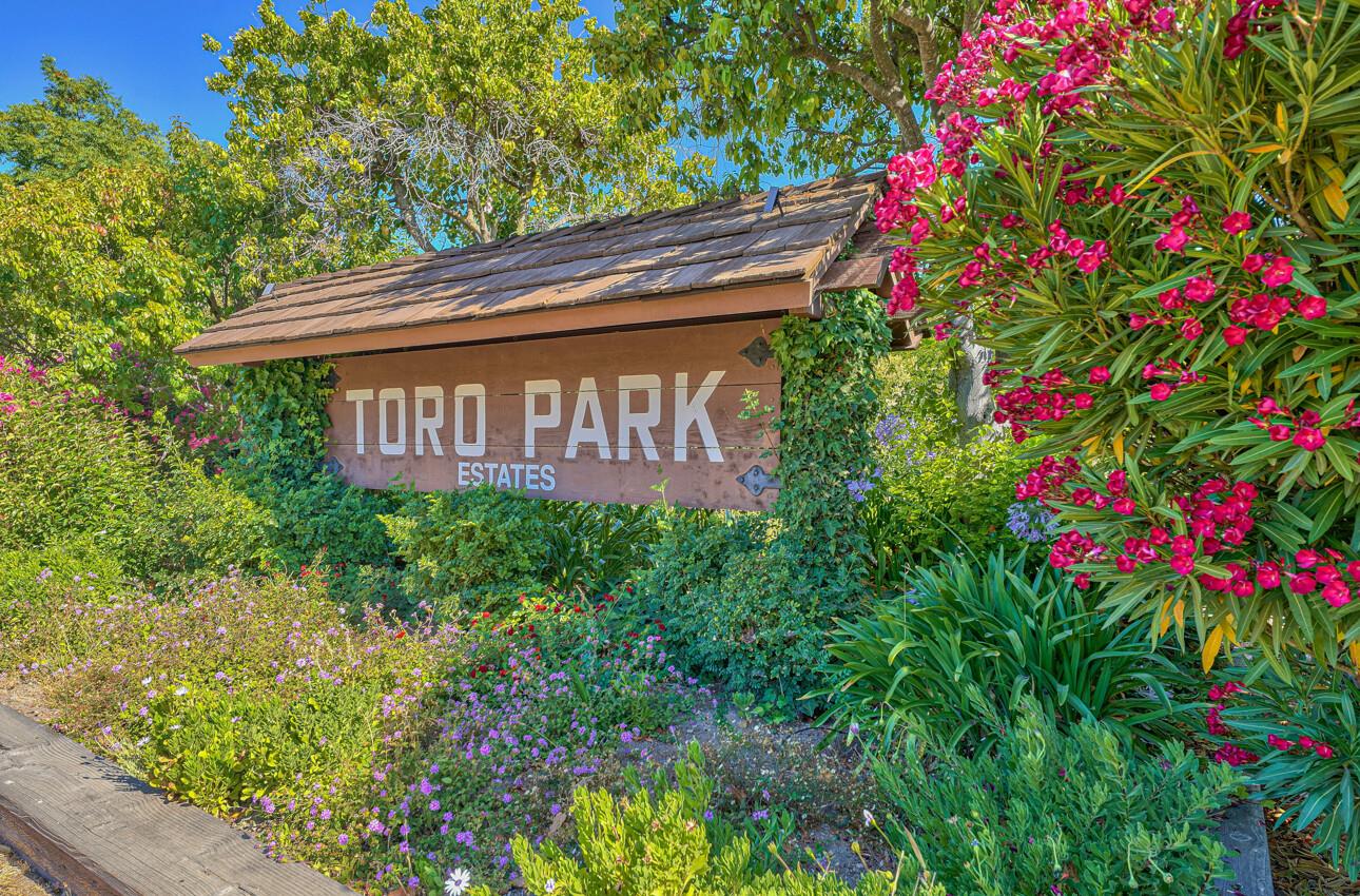 23007 Espada Drive Salinas, CA 93908 - Photo 2 of 39 a sign that is sitting in front of flowers