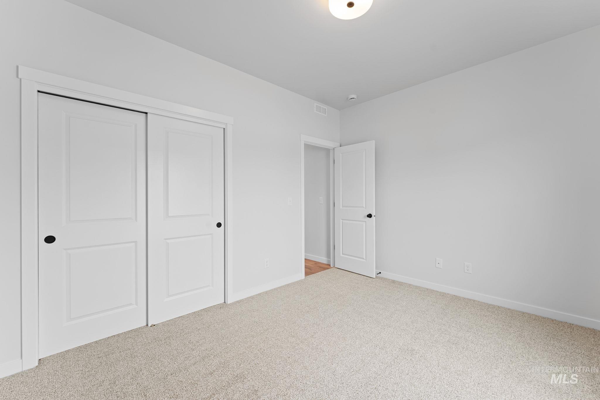2220 Great Basin Way Burley, ID 83318 - Photo 33 of 39 Unfurnished bedroom featuring light carpet and a closet