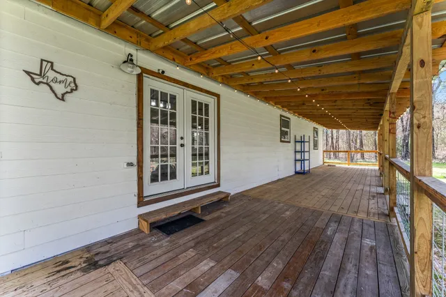 a view of backyard with wooden floor