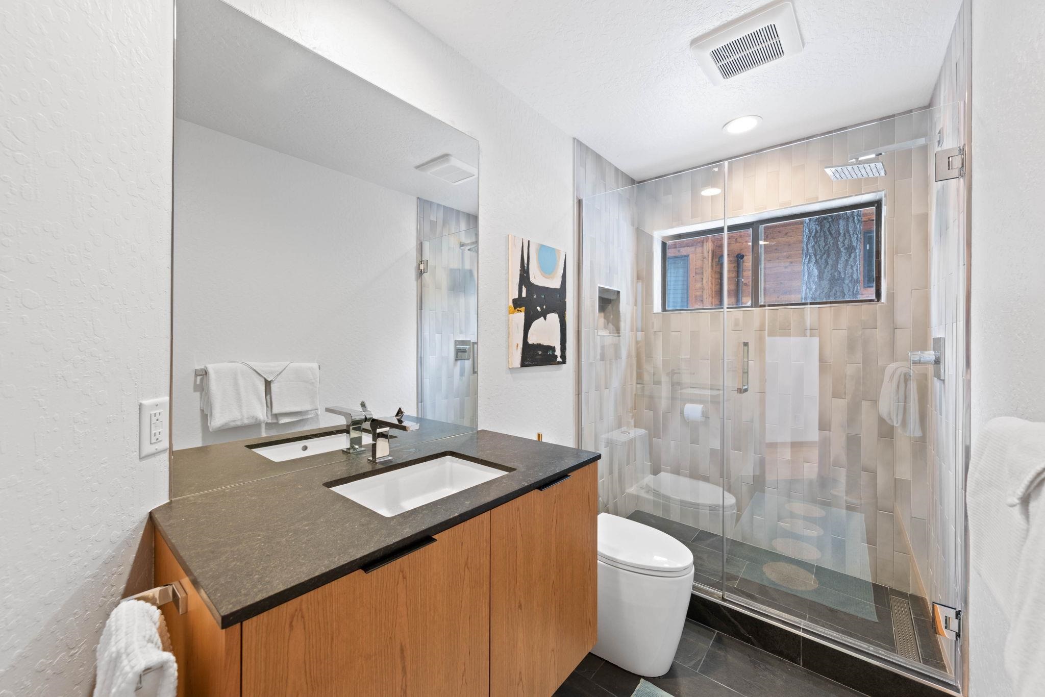 737 Conifer Truckee, CA 96161 - Photo 11 of 21 a bathroom with a granite countertop sink toilet a mirror and shower