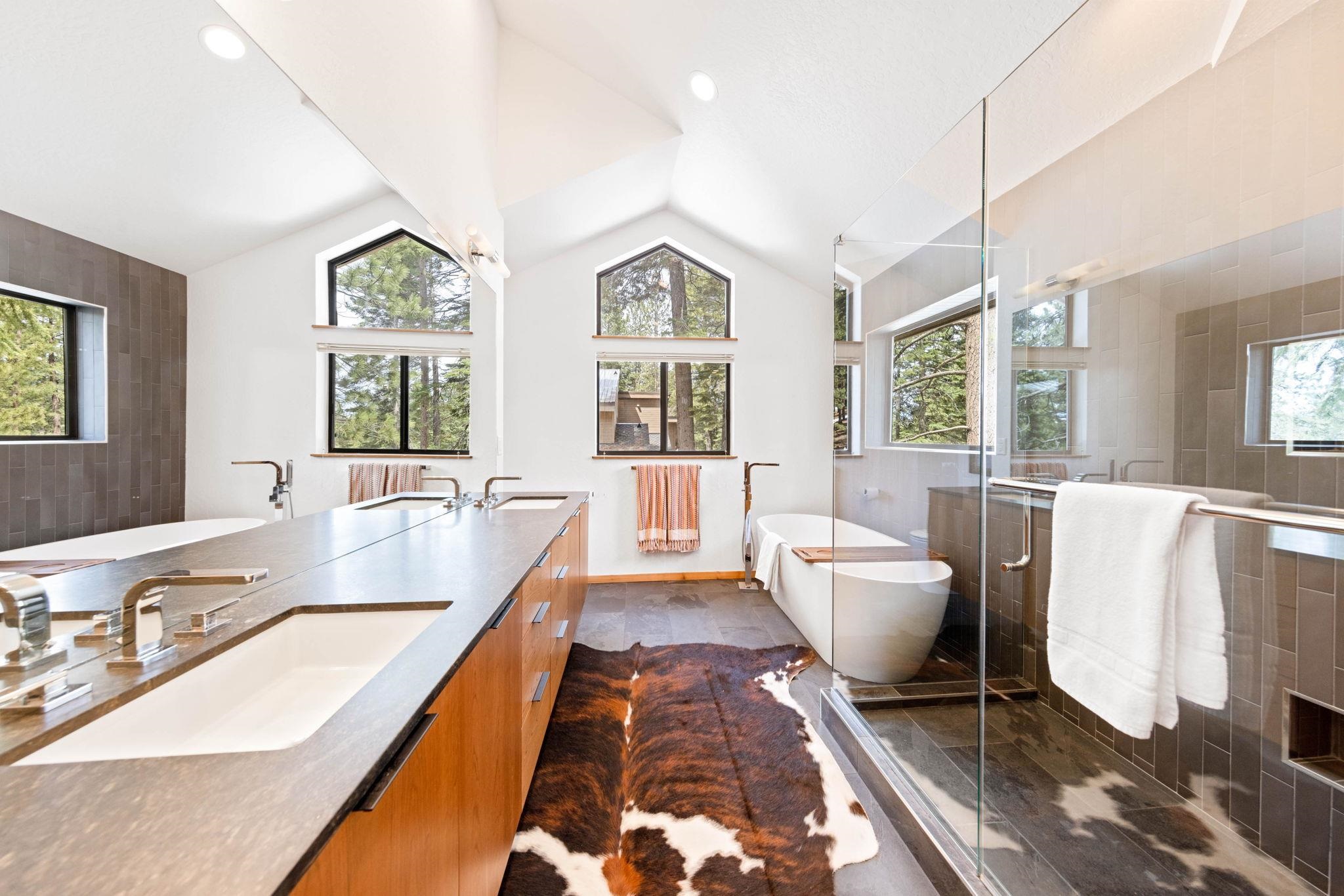 737 Conifer Truckee, CA 96161 - Photo 16 of 21 a spacious bathroom with a double vanity sink a bathtub and window