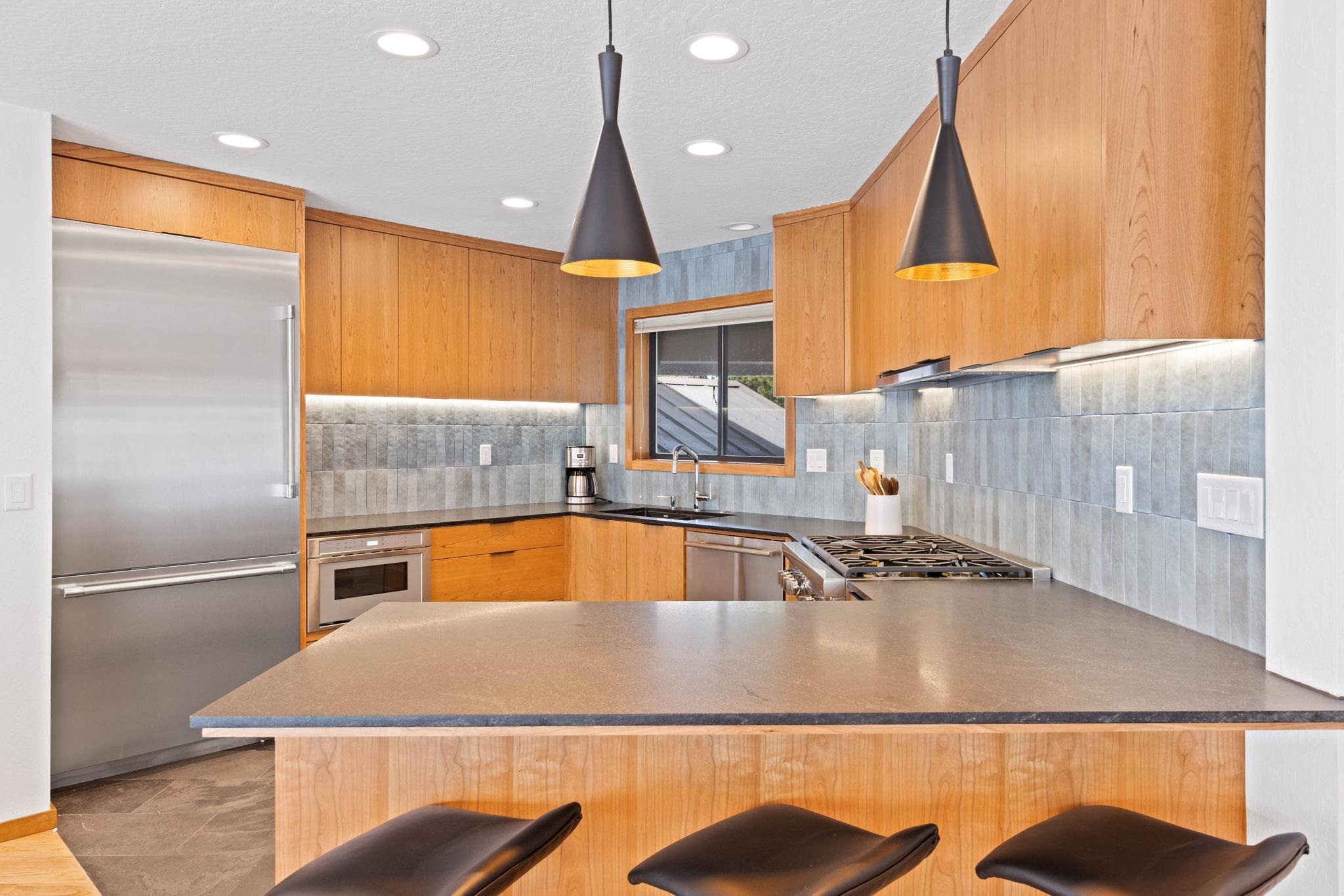 737 Conifer Truckee, CA 96161 - Photo 6 of 21 a view of a kitchen with a sink and living room