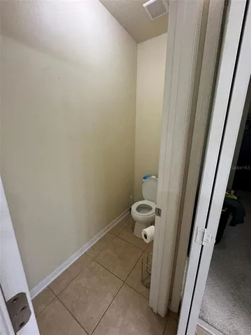 a view of a hallway with staircase