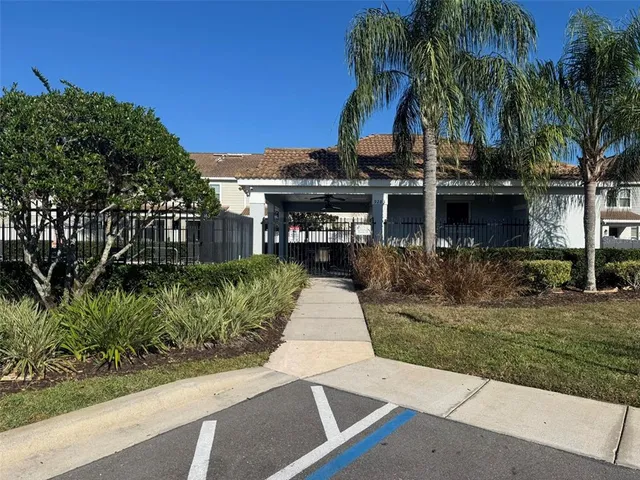 an aerial view of residential building and lake