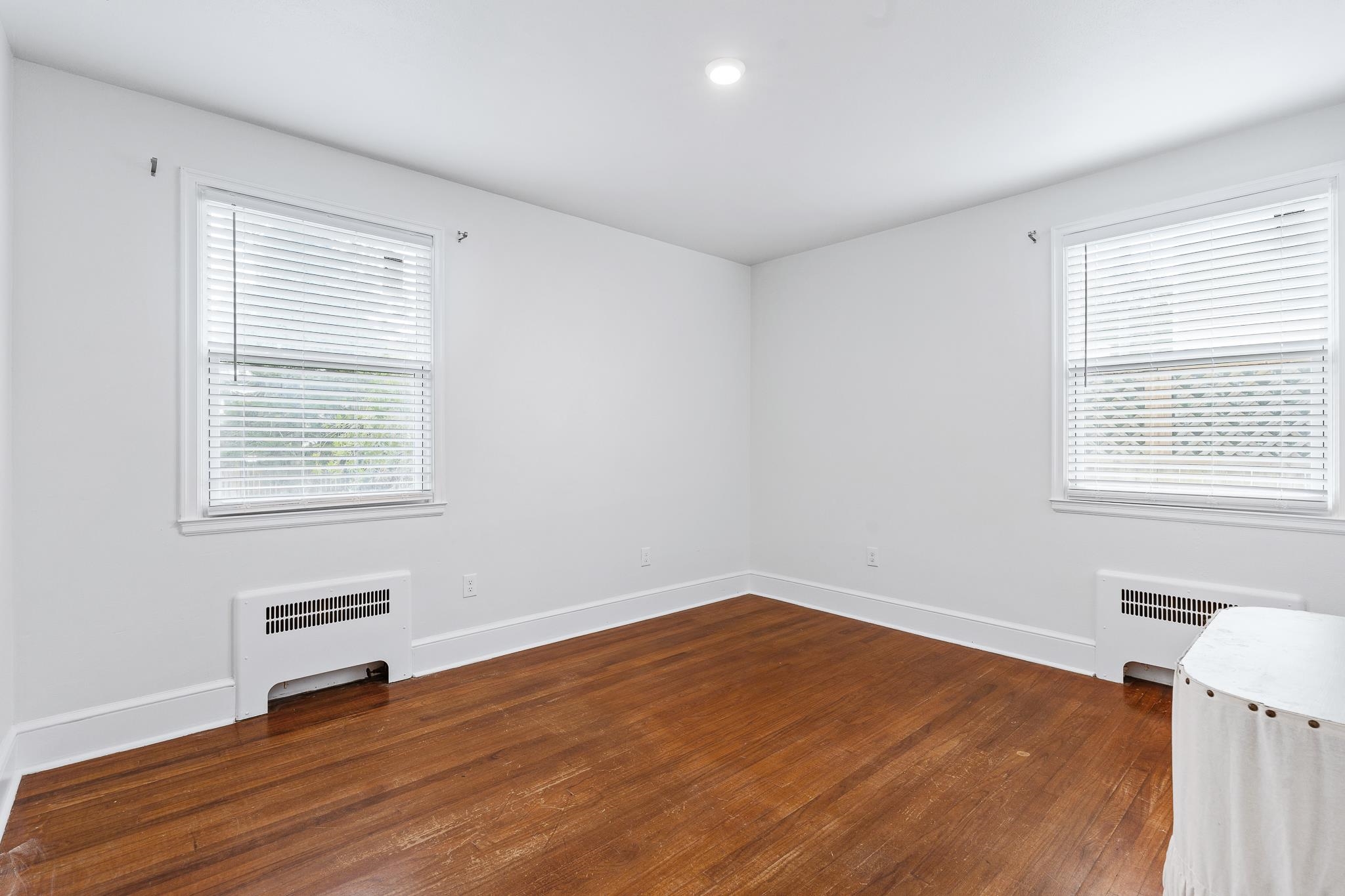 25 May Street St. Augustine, FL 32084 - Photo 27 of 38 a view of an empty room with wooden floor and a window