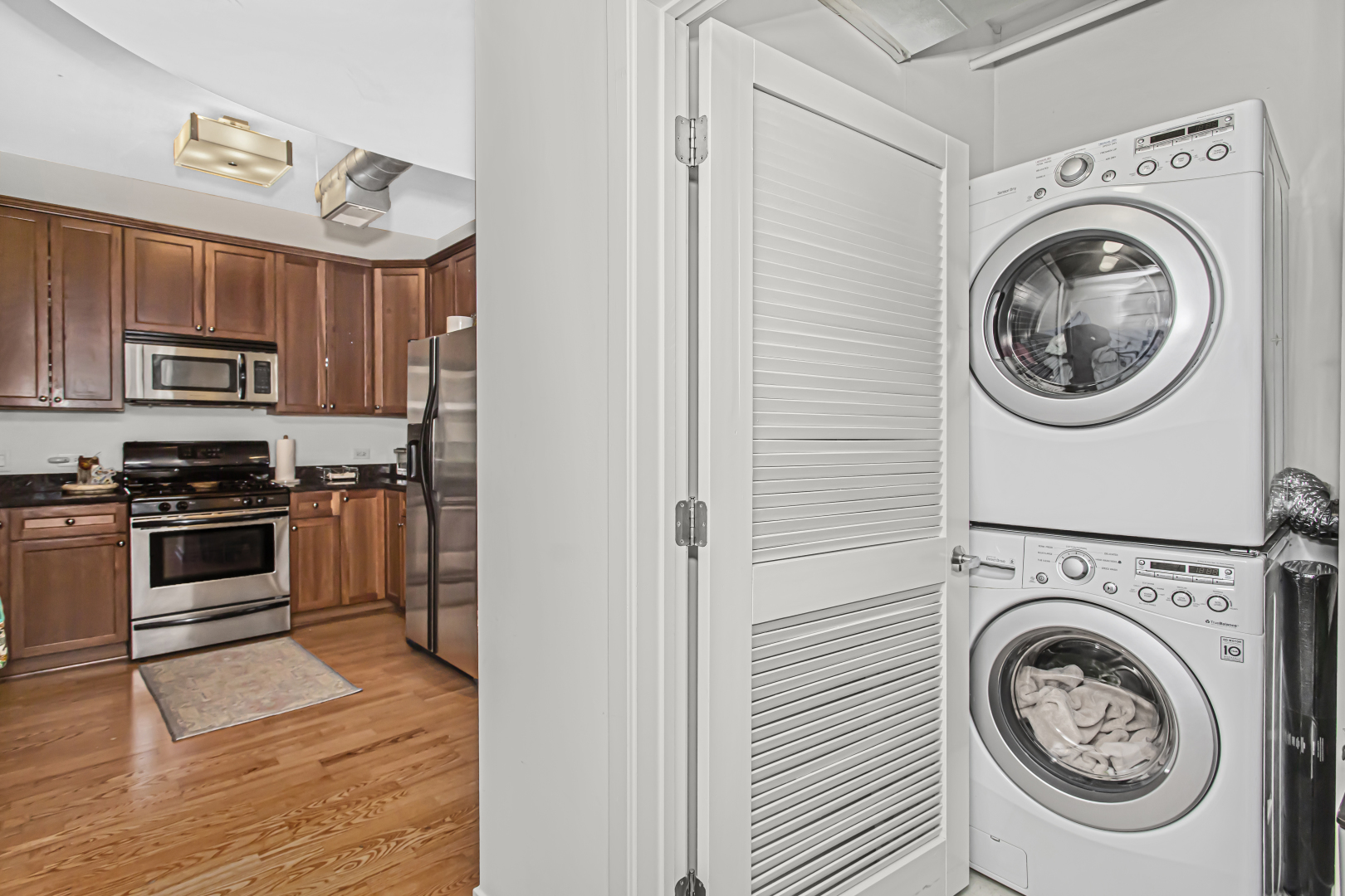 909 West Washington Boulevard, Unit 513 Chicago, IL 60607 - Photo 12 of 25 a view of kitchen sink microwave and stove top oven