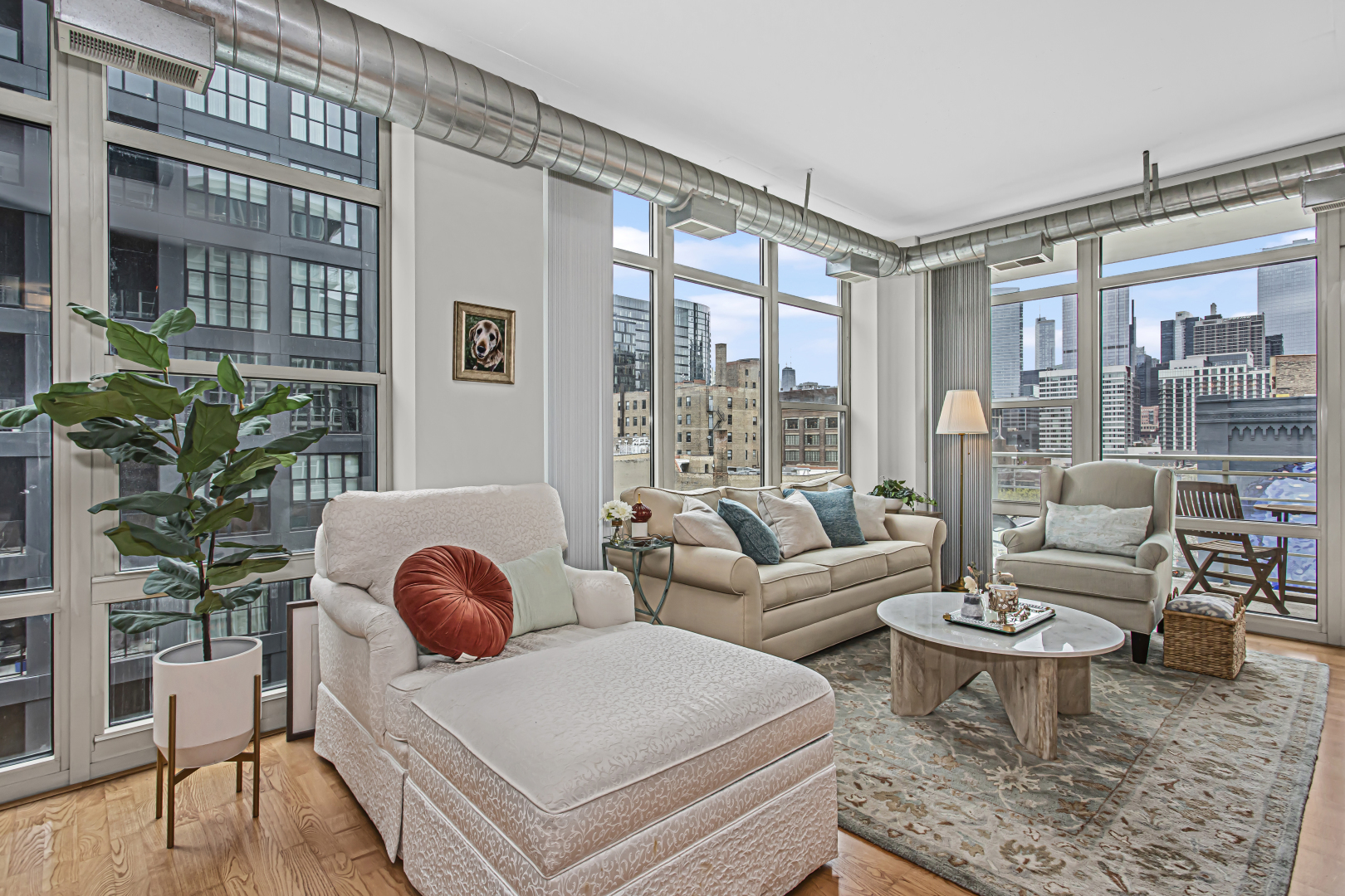 909 West Washington Boulevard, Unit 513 Chicago, IL 60607 - Photo 2 of 25 a living room with furniture and wooden floor