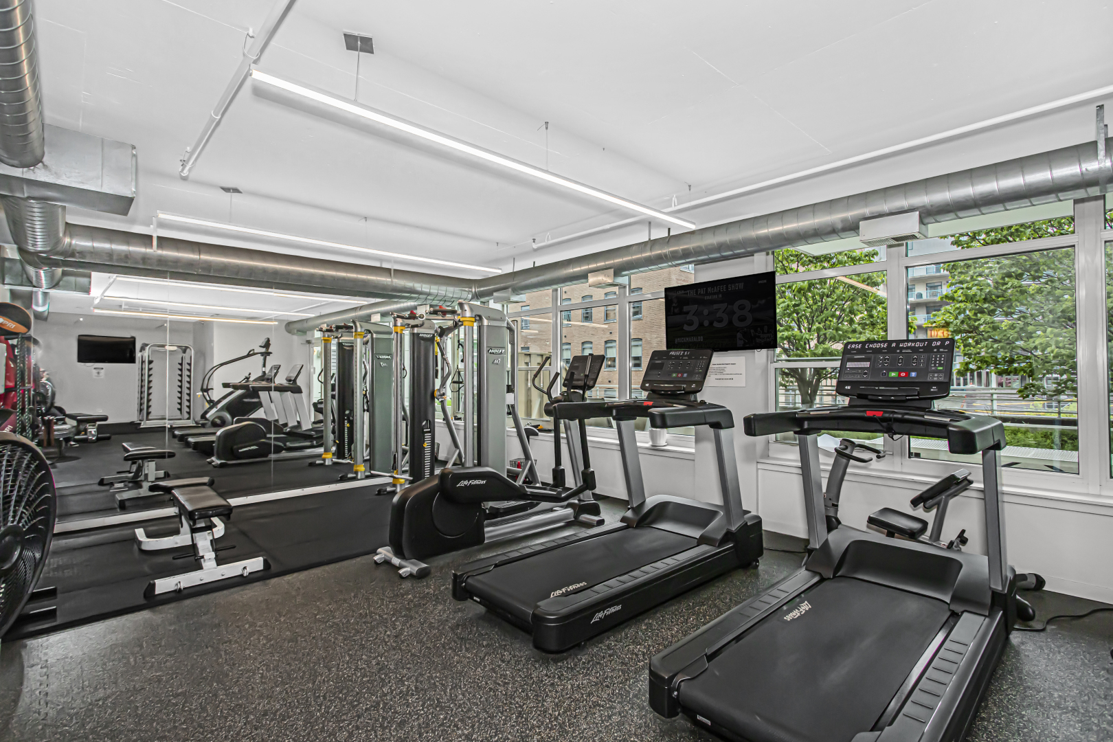 909 West Washington Boulevard, Unit 513 Chicago, IL 60607 - Photo 21 of 25 a view of a room with gym equipment