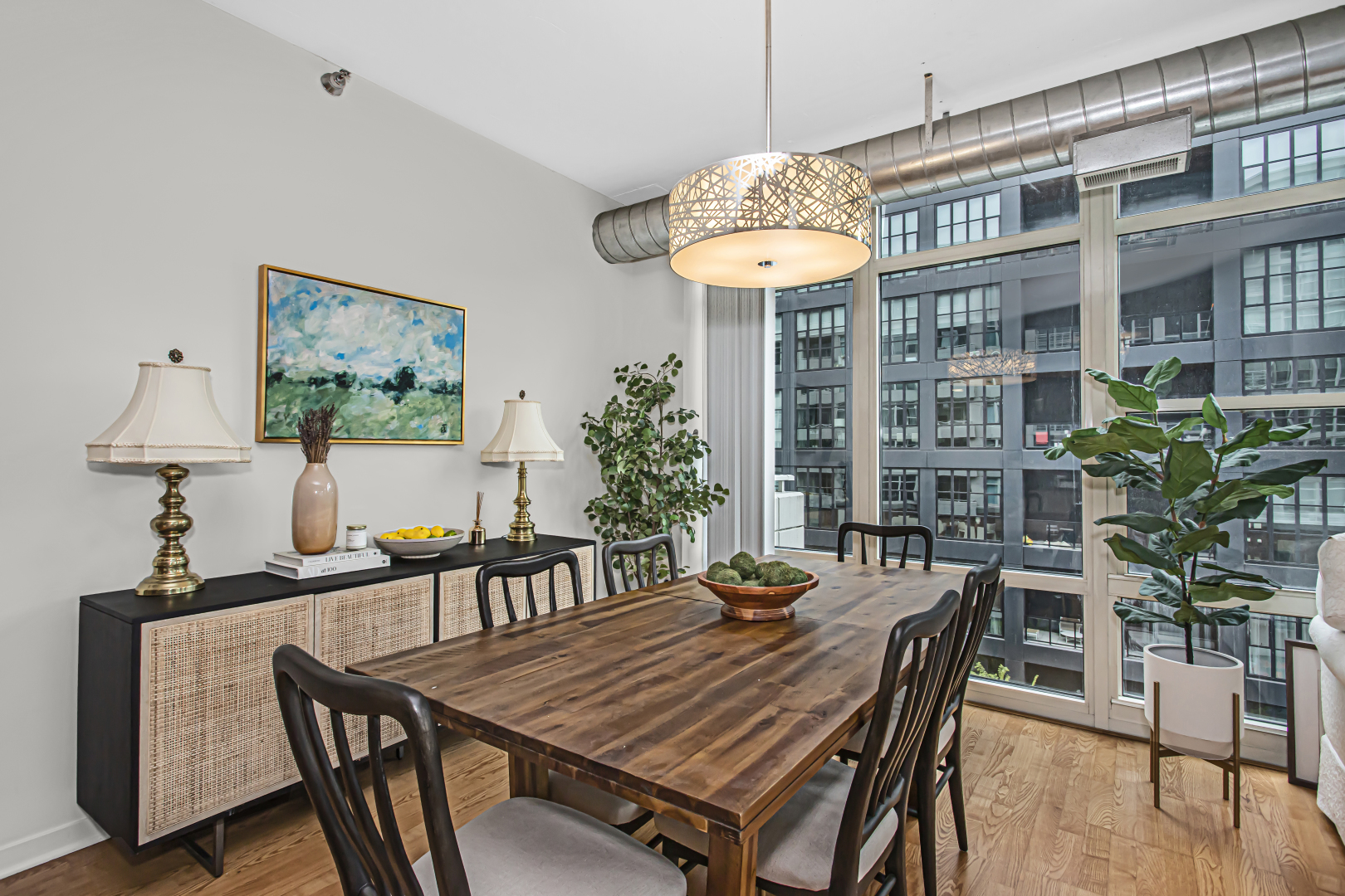909 West Washington Boulevard, Unit 513 Chicago, IL 60607 - Photo 8 of 25 a view of a dining room with furniture wooden floor and chandelier