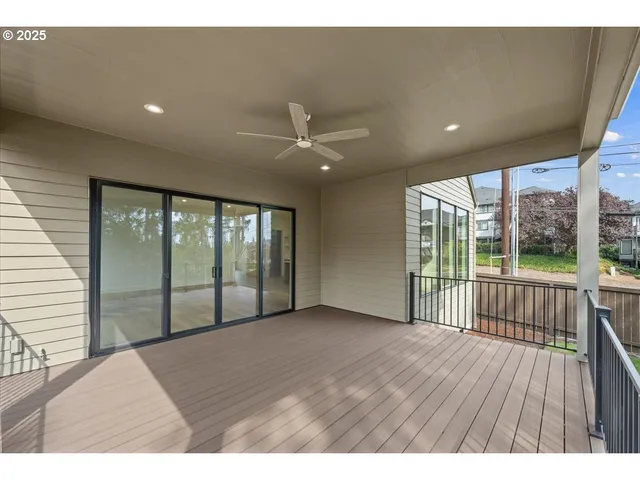 wooden floor in an empty room with a large window