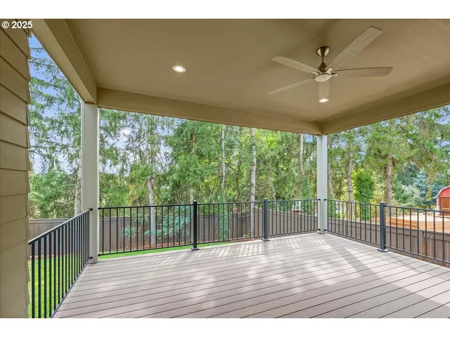 a view of yard with grass and wooden fence