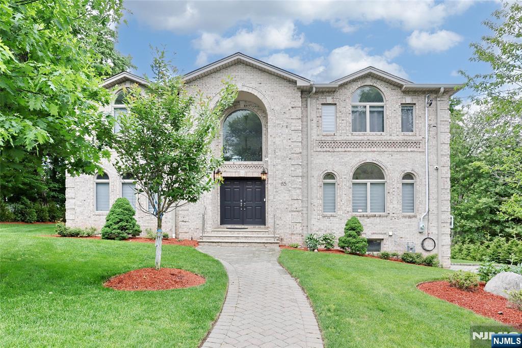 65 Ross Avenue Demarest, NJ 07627 - Photo 1 of 48 a front view of a house with a yard