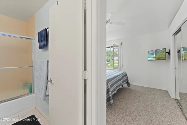 a room that has a bed and a window in it