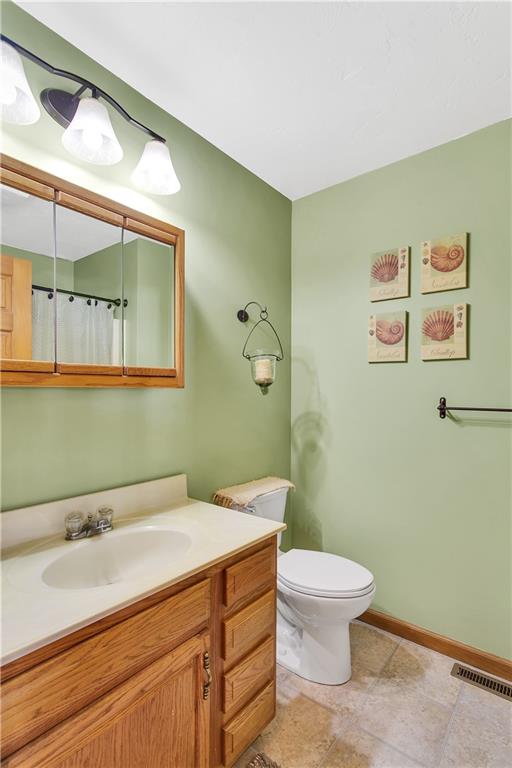 837 Girty Road Shelocta, PA 15774 - Photo 14 of 24 a bathroom with a granite countertop sink mirror vanity and toilet