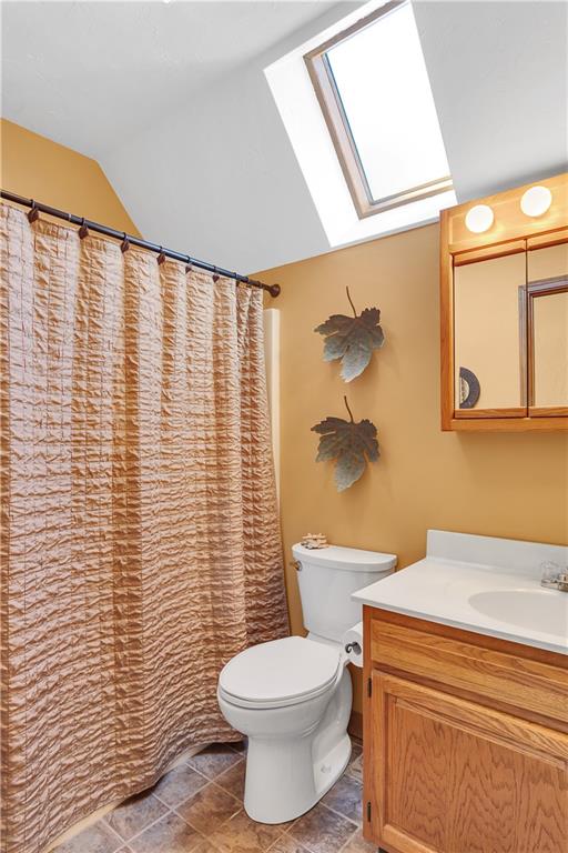 837 Girty Road Shelocta, PA 15774 - Photo 18 of 24 a bathroom with a toilet and a shower curtain
