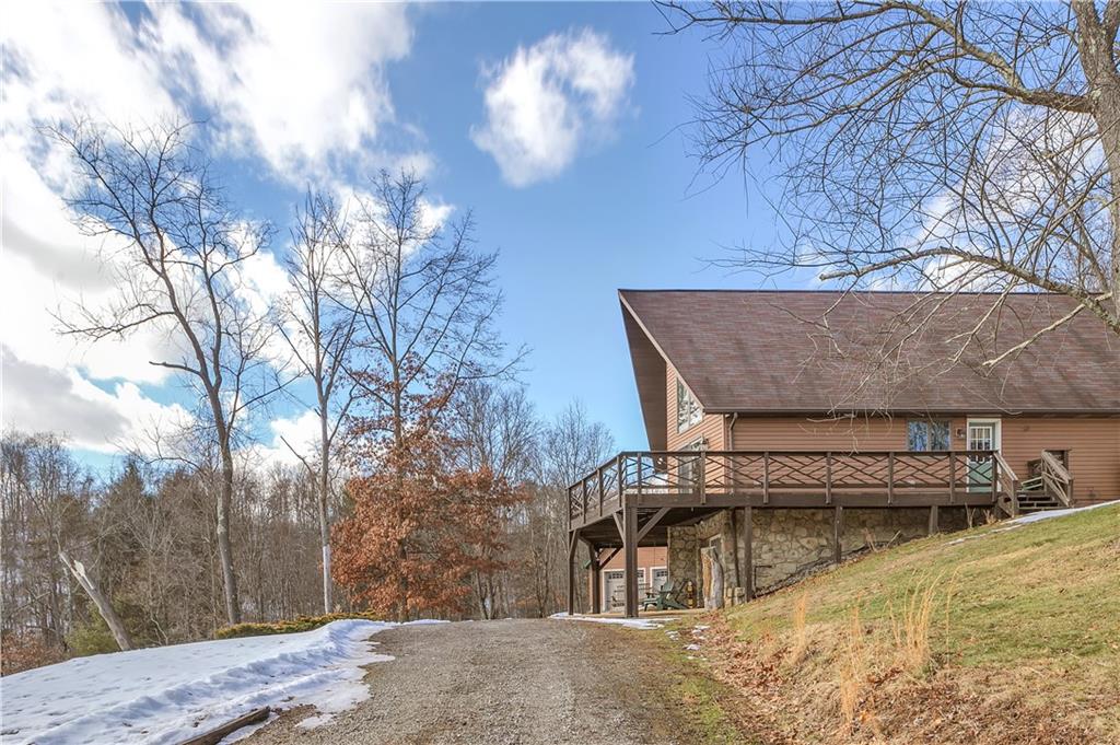 837 Girty Road Shelocta, PA 15774 - Photo 21 of 24 a view of a house with a yard and garage