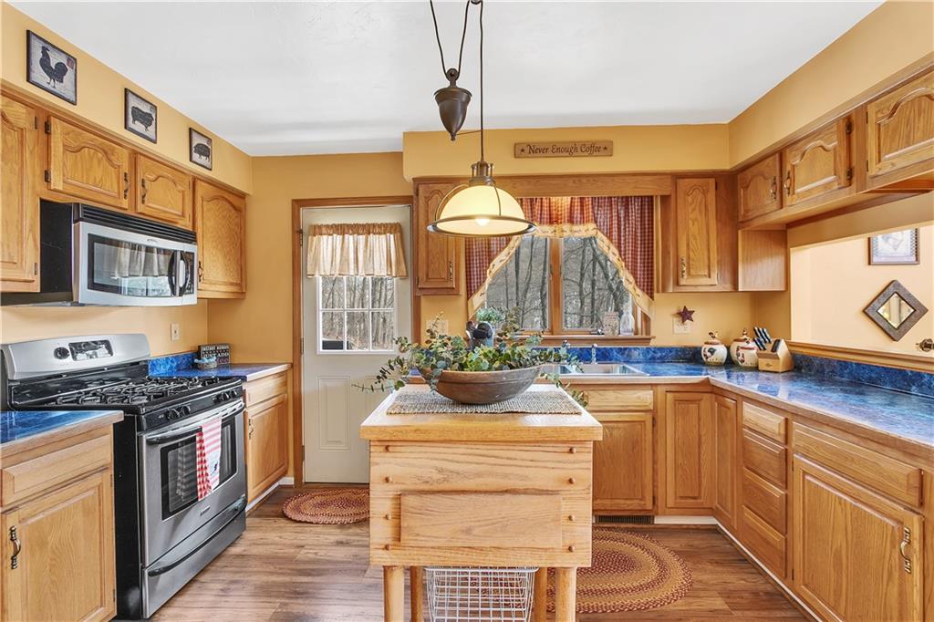 837 Girty Road Shelocta, PA 15774 - Photo 7 of 24 a kitchen with a stove a sink and a refrigerator