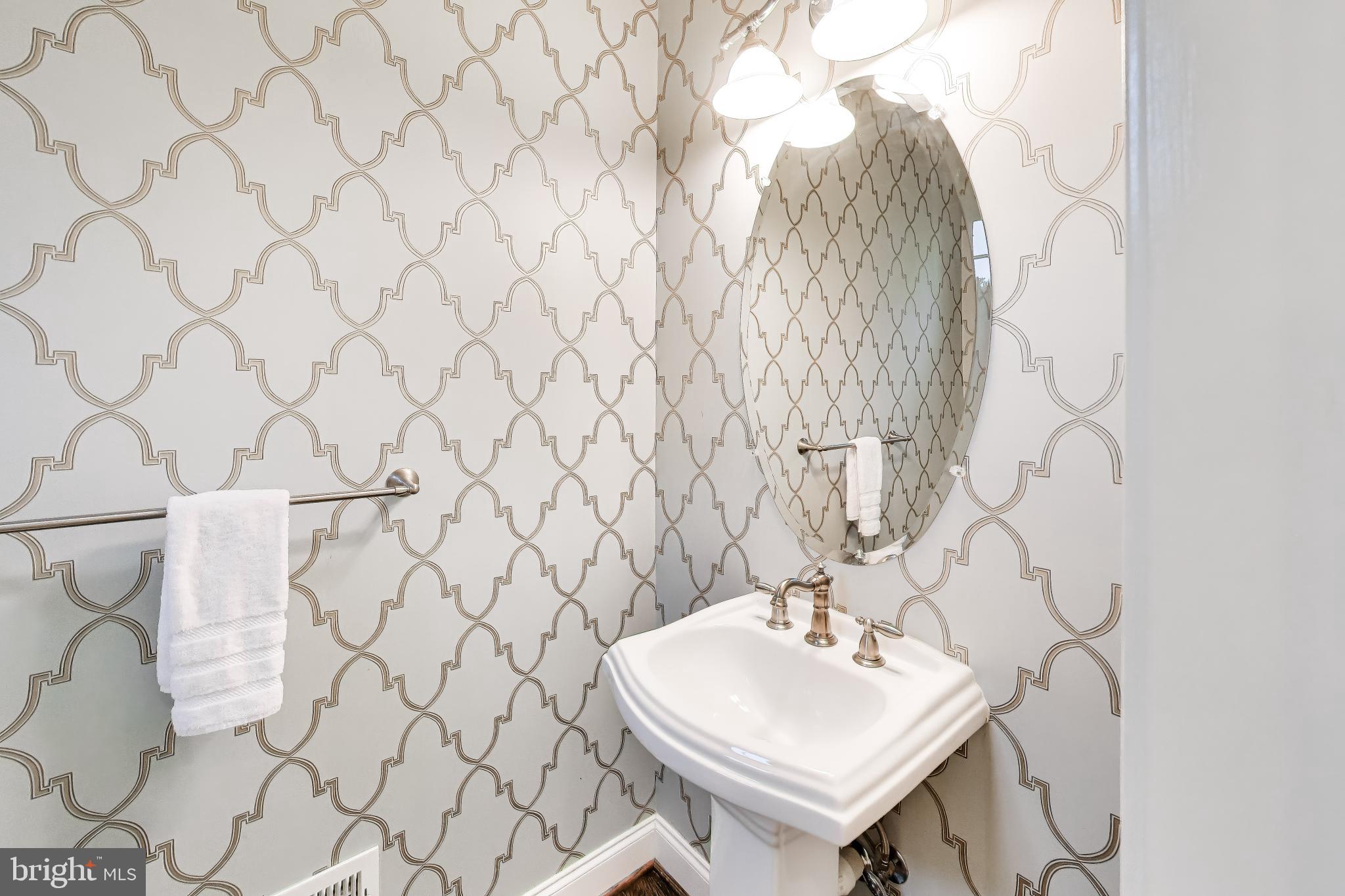 13513 Moonlight Trail Drive Silver Spring, MD 20906 - Photo 23 of 78 a bathroom with a sink a toilet and a mirror