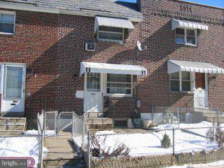 557 Snowden Road Upper Darby, PA 19082 - Photo 1 of 6 a front view of a house with glass windows