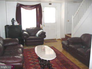 557 Snowden Road Upper Darby, PA 19082 - Photo 2 of 6 a living room with furniture and a window