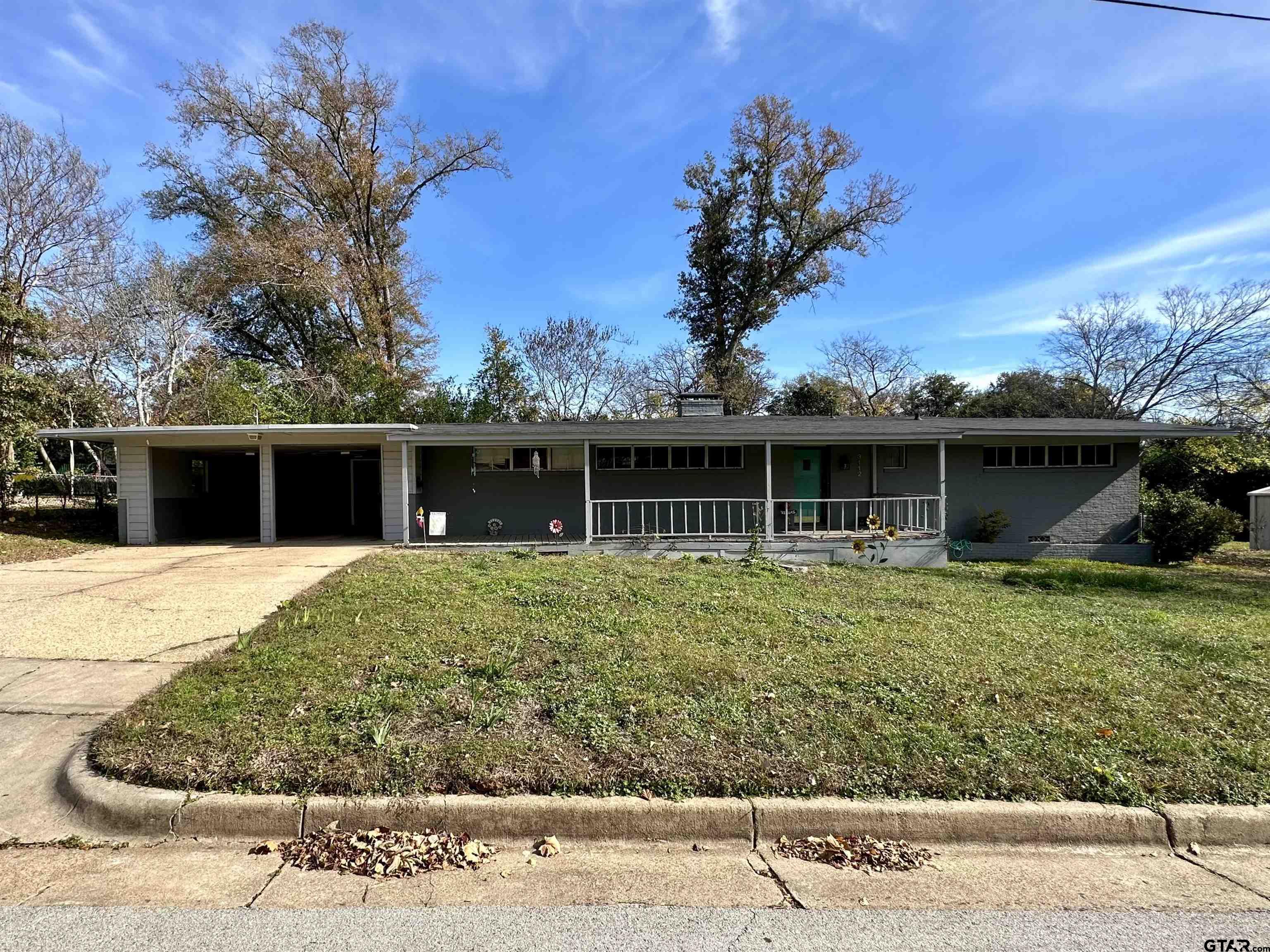 front view of a house with a yard