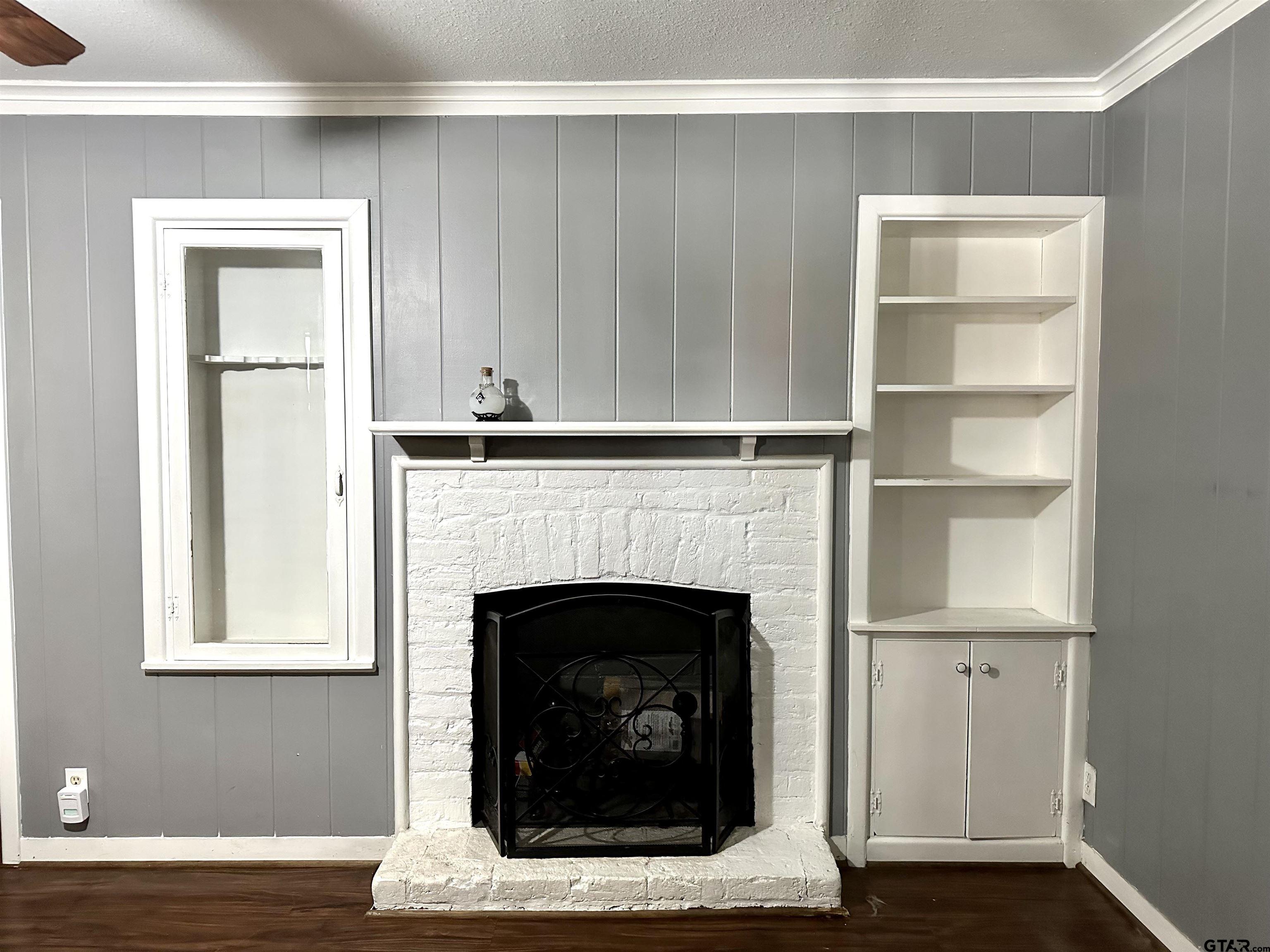 3112 Hallmark Place Tyler, TX 75701 - Photo 16 of 16 a living room with a fireplace in it and a window