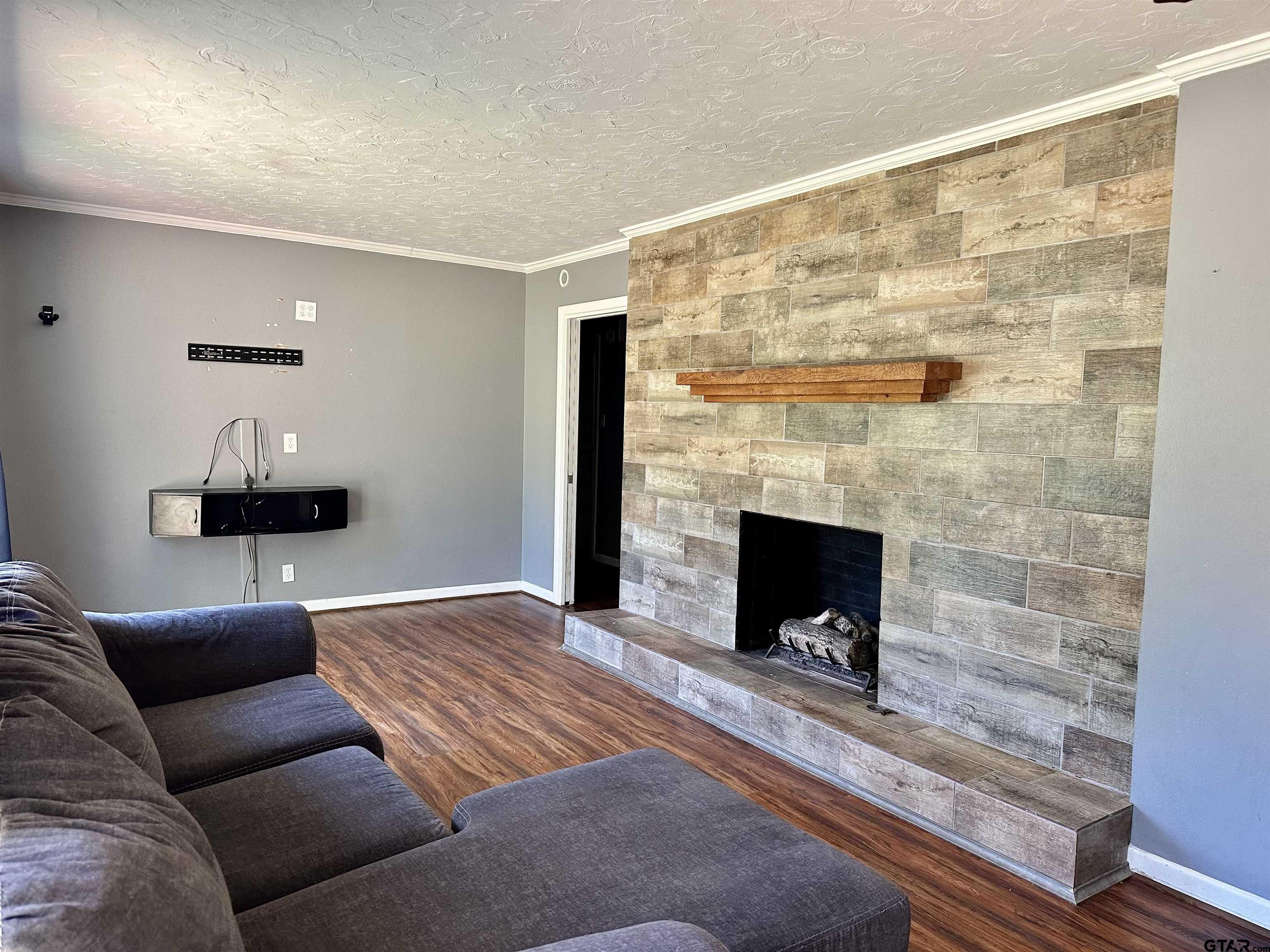 3112 Hallmark Place Tyler, TX 75701 - Photo 9 of 16 a living room with furniture and a fireplace