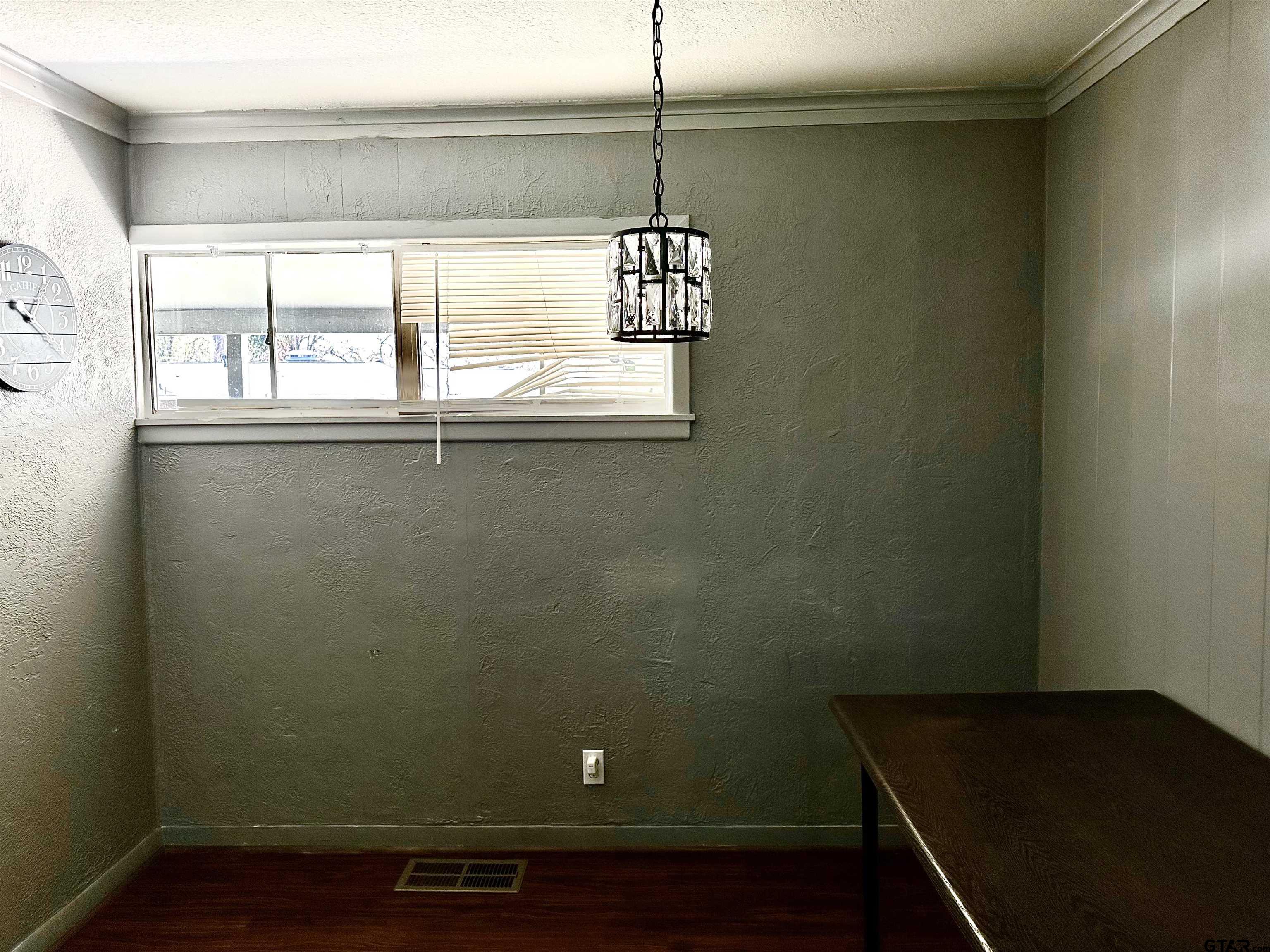 3112 Hallmark Place Tyler, TX 75701 - Photo 10 of 16 a view of a small space with wooden floor and a window