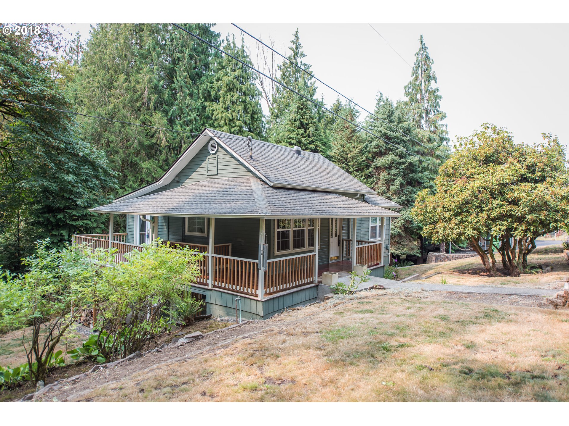 29503 Old Rainier Road Rainier, OR 97048 - Photo 1 of 22 a front view of a house with a garden