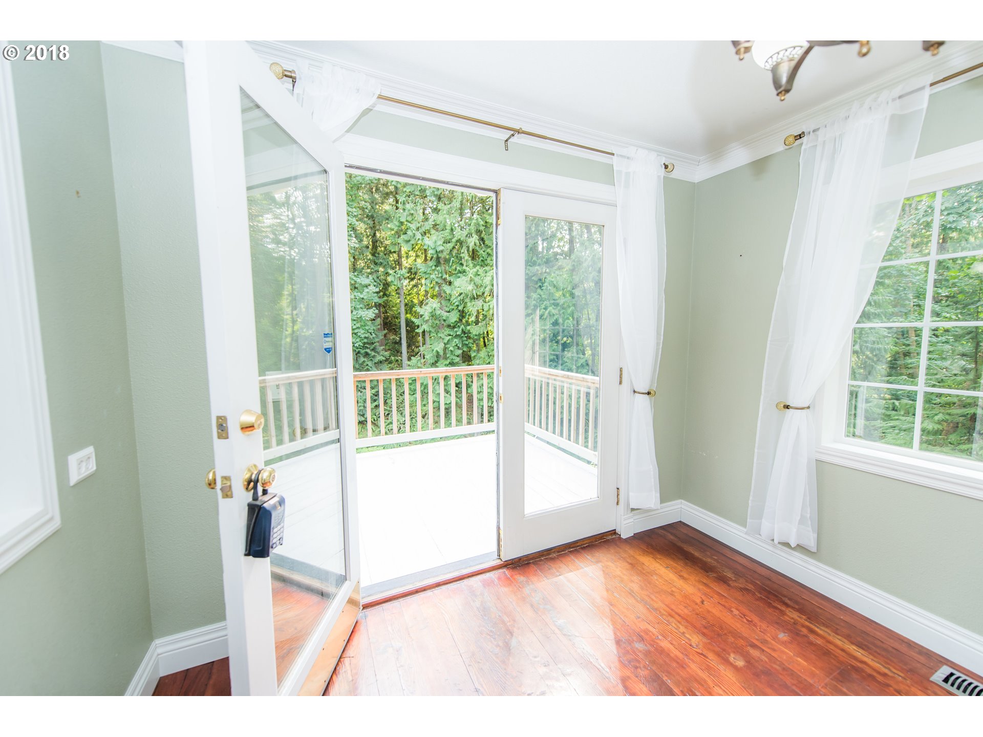 29503 Old Rainier Road Rainier, OR 97048 - Photo 11 of 22 a view of a room with wooden floor and windows