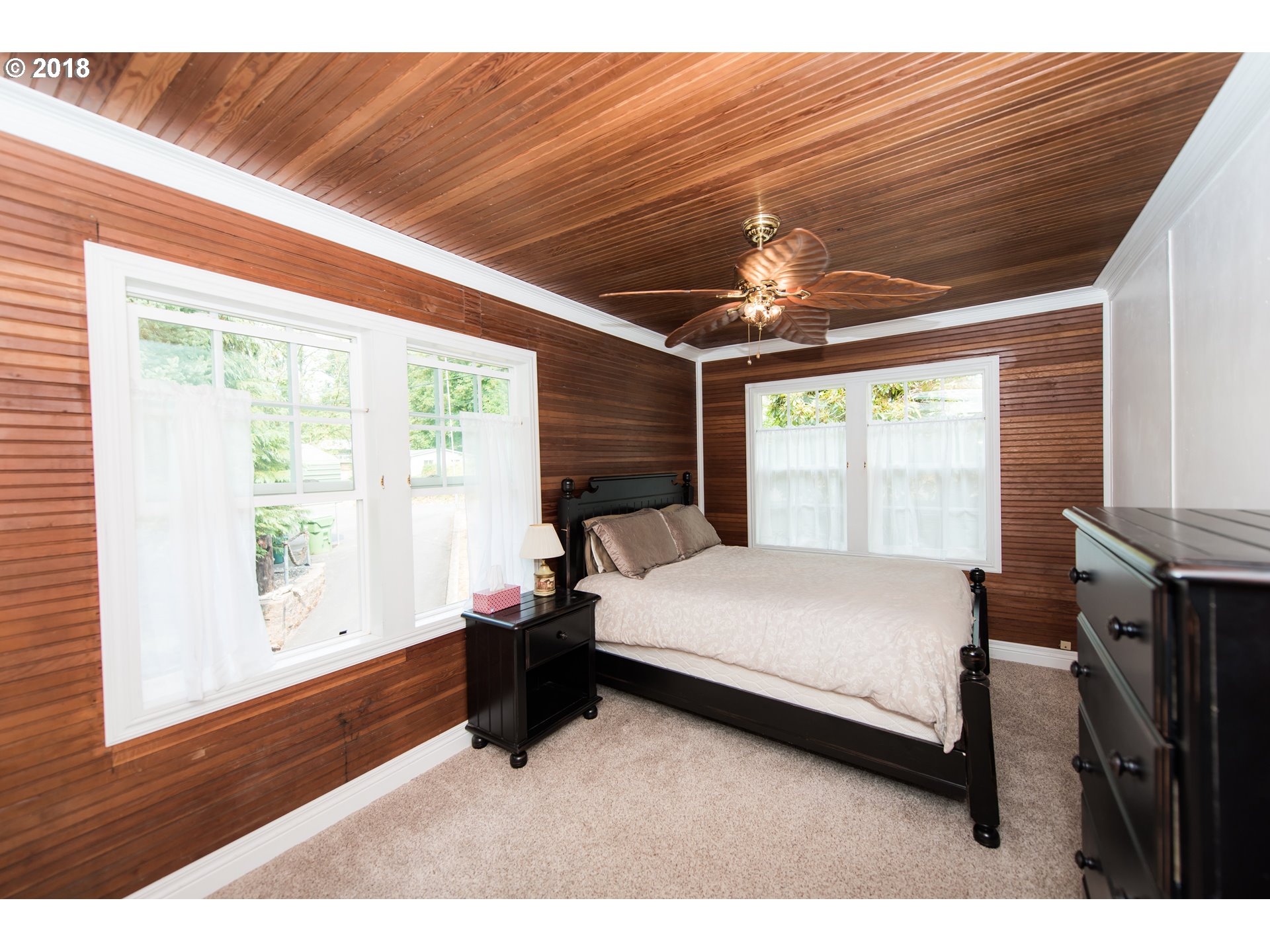 29503 Old Rainier Road Rainier, OR 97048 - Photo 12 of 22 a spacious bedroom with a large bed and a large window
